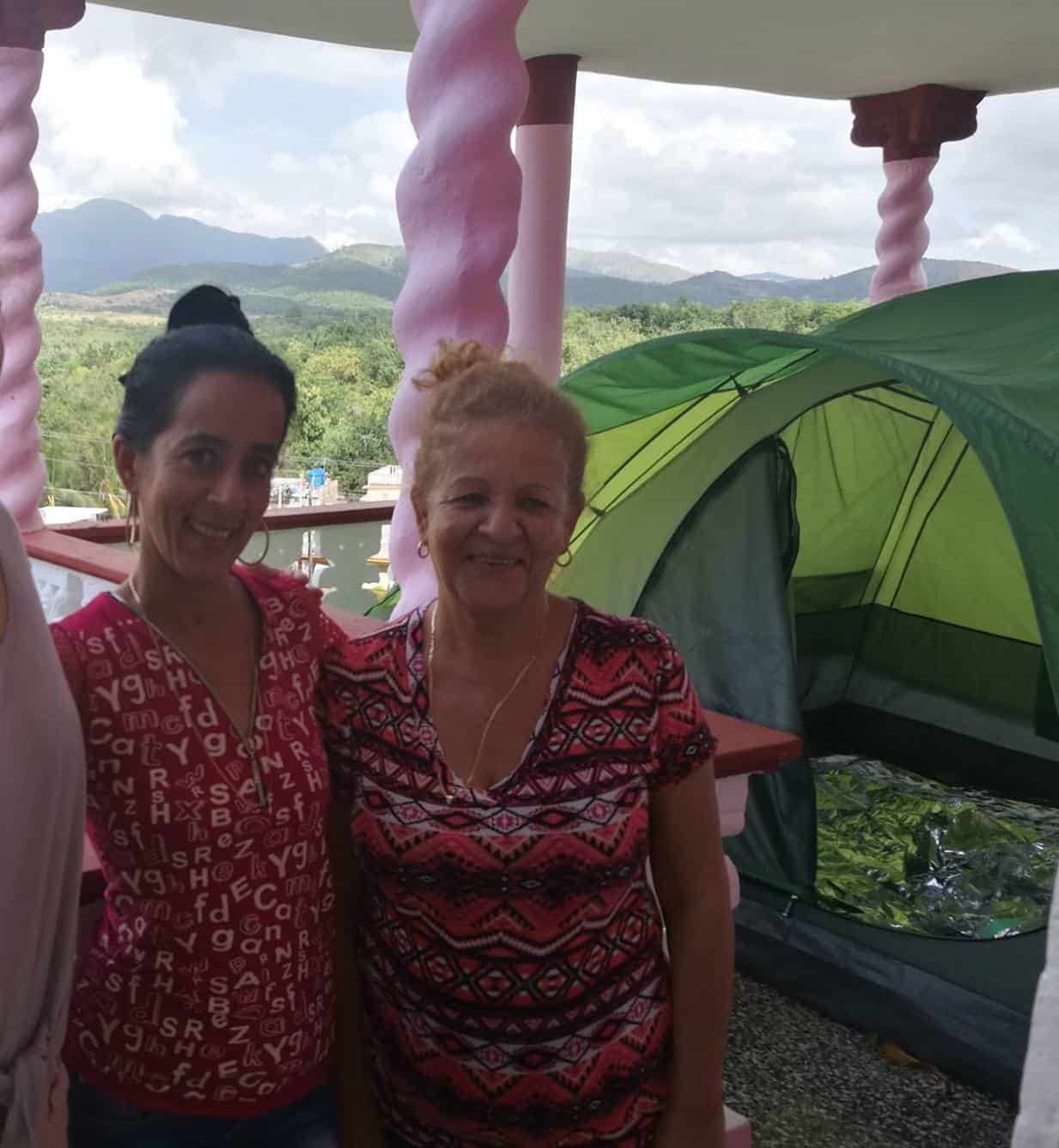 My Airbnb hosts on the balcony of the home that has my tent on the balcony in La Boca Cuba