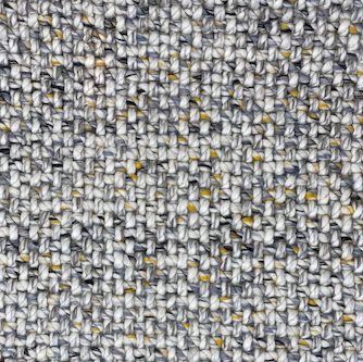 close up of a woven rug, with light greys, dark greys and some yellow