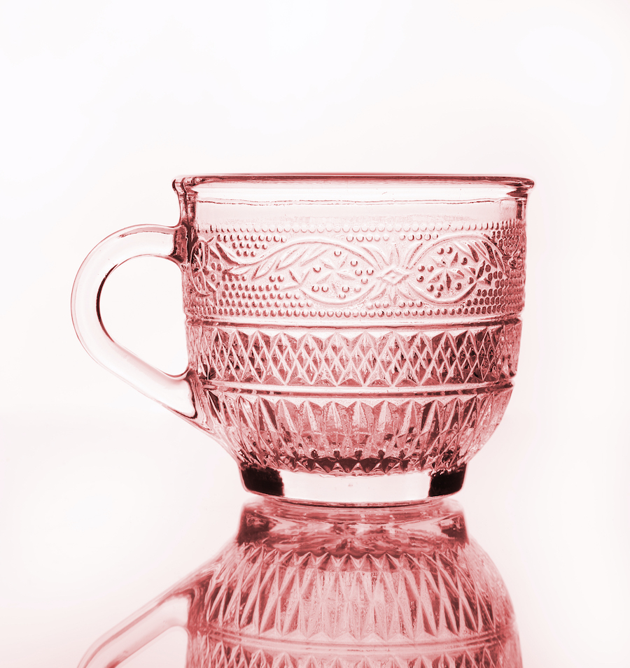A pink Depression glass era mug