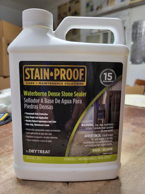 A jug of Stain Proof Waterborne Dense Stone Sealer