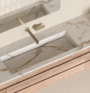 off-white with brown veining countertop in a bathroom with a sink made of the same material